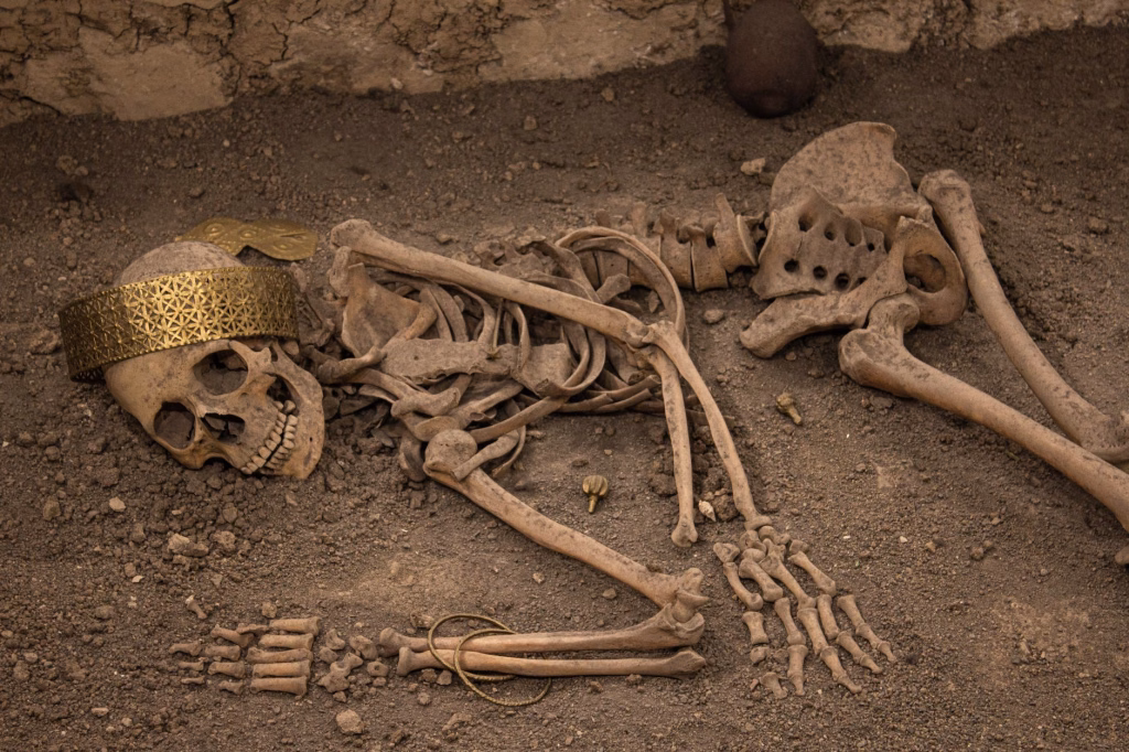 Family members carrying wrapped remains during a Famadihana turning of the bones ceremony in Madagascar