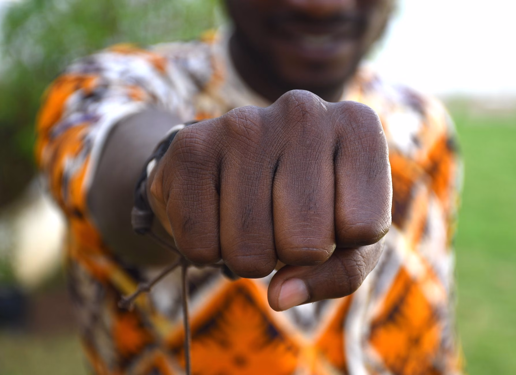 Close-up of hands with fingers bent back showing why knuckles crack