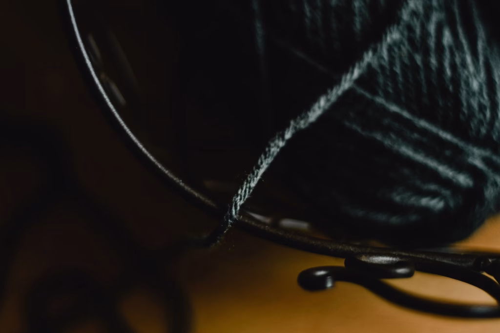 Closeup of gray and white hair strands showing why hair turns white with age